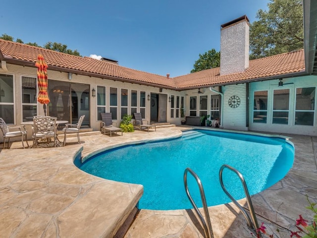 1425 Meyers Rd, Irving, TX 75060 - outdoor pool with a patio and a ceiling fan