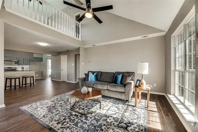 4914 Redwater Dr, Arlington, TX 76018 - living area with ceiling fan, dark wood-type flooring, and high vaulted ceiling