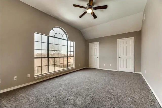 4914 Redwater Dr, Arlington, TX 76018 - carpeted empty room with ceiling fan and lofted ceiling