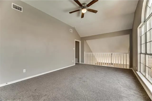 4914 Redwater Dr, Arlington, TX 76018 - empty room with ceiling fan, lofted ceiling, and carpet