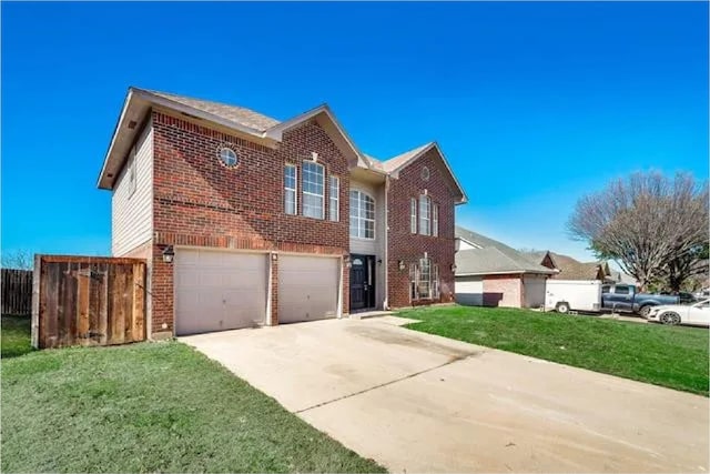 4914 Redwater Dr, Arlington, TX 76018 - view of front of home with brick siding, concrete driveway, and a garage