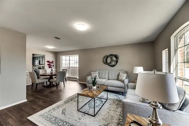4914 Redwater Dr, Arlington, TX 76018 - living area with dark wood finished floors and baseboards