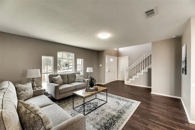 4914 Redwater Dr, Arlington, TX 76018 - living area featuring stairs and wood finished floors