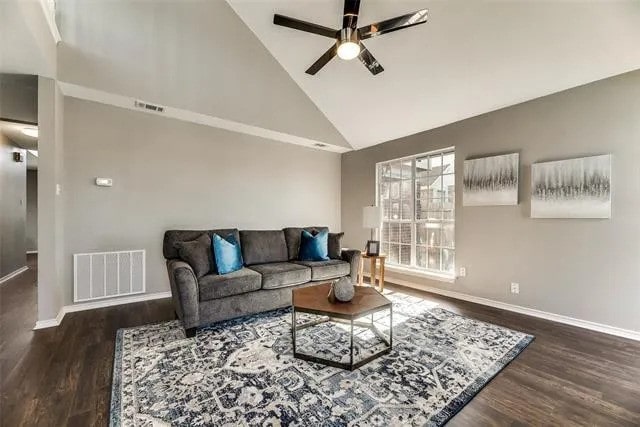 4914 Redwater Dr, Arlington, TX 76018 - living area with a ceiling fan, high vaulted ceiling, and wood finished floors