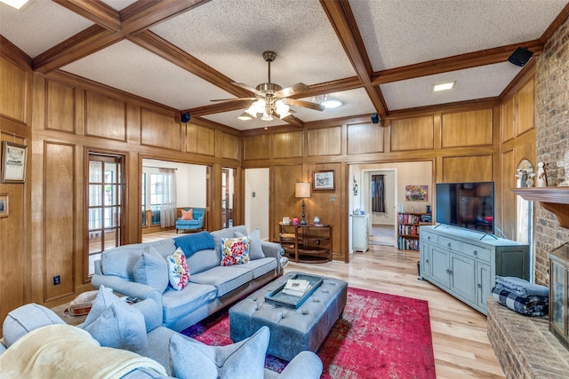 128 Timber Ridge Dr, Murphy, TX 75094 - living area with a brick fireplace, light wood finished floors, ceiling fan, beam ceiling, and crown molding