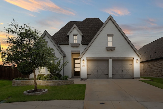 3700 Blue Stream Dr, Little Elm, TX 75068 - view of front of home with roof with shingles, concrete driveway, a yard, and brick siding