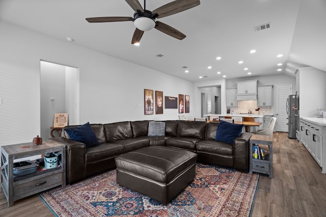 3700 Blue Stream Dr, Little Elm, TX 75068 - living room featuring dark wood-type flooring, a ceiling fan, recessed lighting, and vaulted ceiling