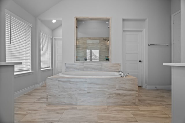 3700 Blue Stream Dr, Little Elm, TX 75068 - full bath featuring a garden tub, vaulted ceiling, and marble finish flooring