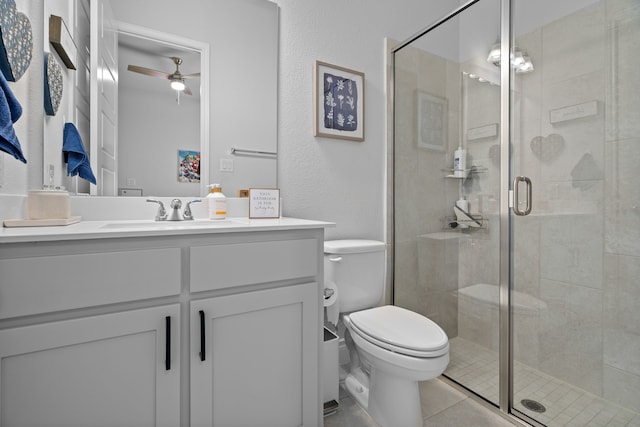 3700 Blue Stream Dr, Little Elm, TX 75068 - full bathroom featuring ceiling fan, vanity, a shower stall, tile patterned floors, and a textured wall