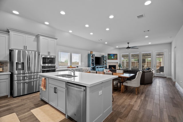 3700 Blue Stream Dr, Little Elm, TX 75068 - kitchen featuring stainless steel appliances, ceiling fan, recessed lighting, a kitchen island with sink, and light countertops