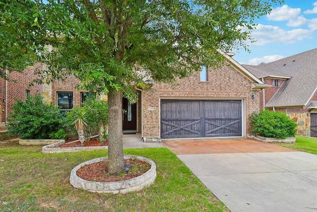 1009 Chickasaw Dr, Carrollton, TX 75010 - view of front of property with an attached garage, concrete driveway, a front lawn, and brick siding