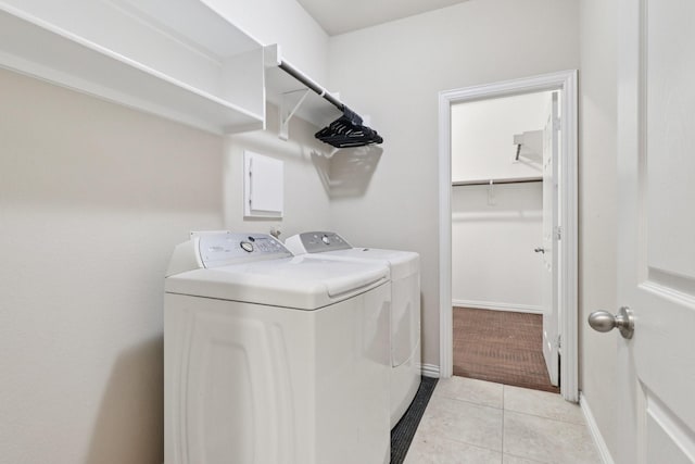 1009 Chickasaw Dr, Carrollton, TX 75010 - washroom featuring separate washer and dryer and light tile patterned flooring