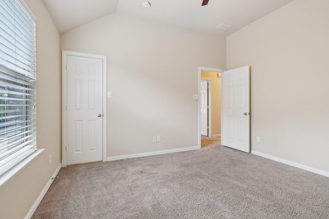 1009 Chickasaw Dr, Carrollton, TX 75010 - unfurnished bedroom with carpet, lofted ceiling, and ceiling fan