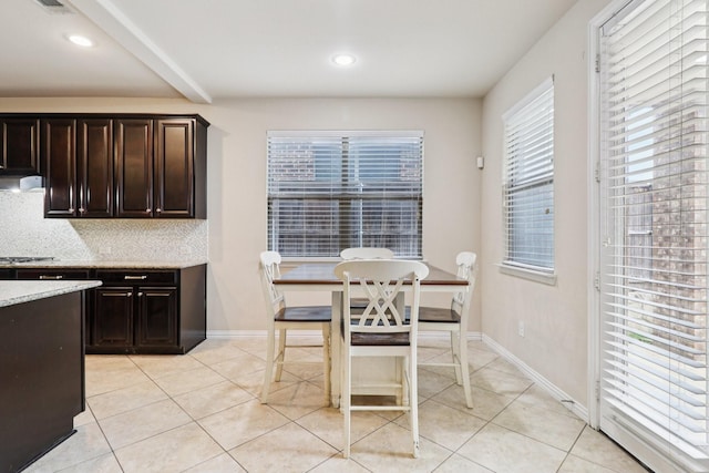 1009 Chickasaw Dr, Carrollton, TX 75010 - dining space with light tile patterned flooring, plenty of natural light, and recessed lighting