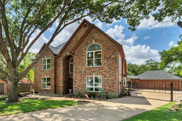 3252 Shady Glen Dr, Grapevine, TX 76051 - view of front of property featuring a gate, brick siding, and concrete driveway