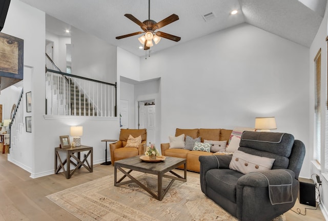 3252 Shady Glen Dr, Grapevine, TX 76051 - living room featuring high vaulted ceiling, a ceiling fan, stairway, wood finished floors, and recessed lighting