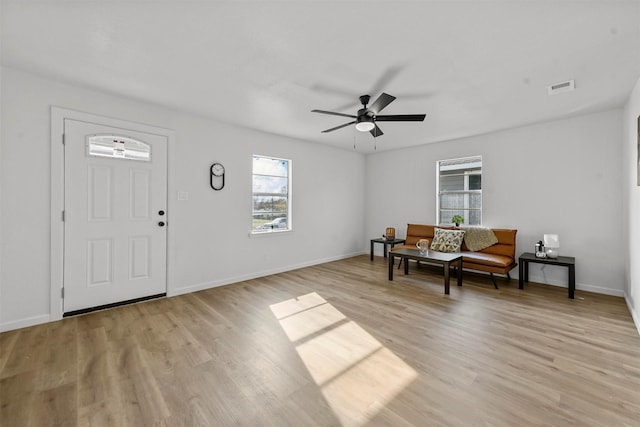 1830 San Antonio St, Grand Prairie, TX 75051 - entrance foyer with plenty of natural light, light wood finished floors, and ceiling fan