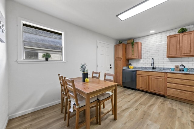 1830 San Antonio St, Grand Prairie, TX 75051 - dining space with light wood-style floors and baseboards