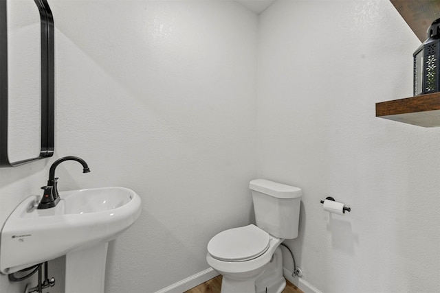 1830 San Antonio St, Grand Prairie, TX 75051 - half bath with baseboards and wood finished floors