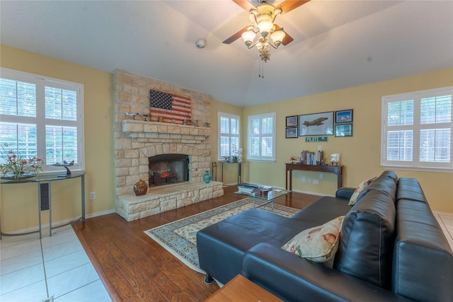 2713 Willowood Dr, Grapevine, TX 76051 - living area featuring a ceiling fan, healthy amount of natural light, wood finished floors, and a fireplace
