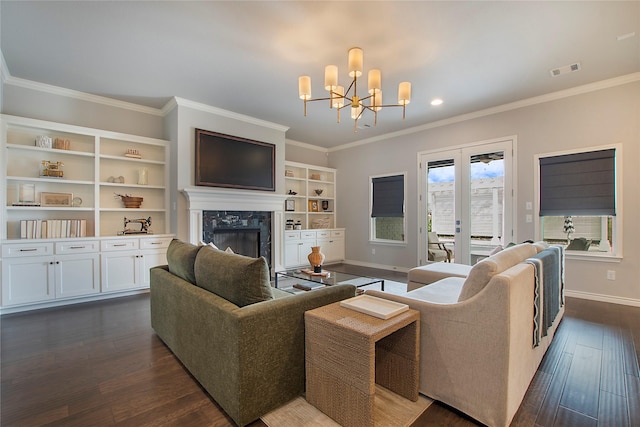 712 Tallgrass Dr, Aledo, TX 76008 - living room with a chandelier, a fireplace, dark wood-type flooring, crown molding, and recessed lighting
