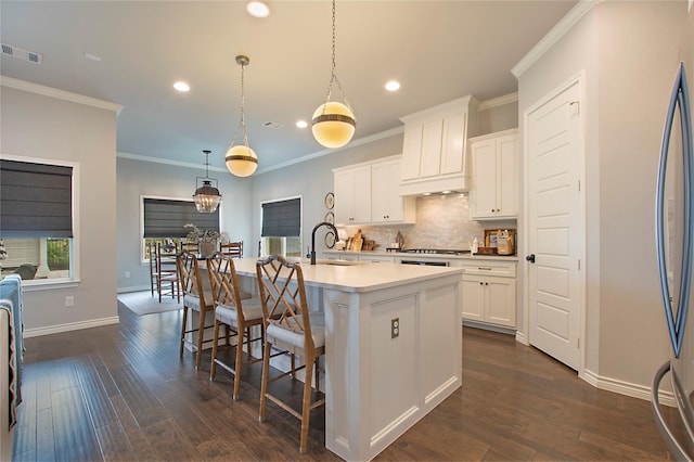 712 Tallgrass Dr, Aledo, TX 76008 - kitchen featuring recessed lighting, decorative backsplash, dark wood finished floors, a center island with sink, and light countertops