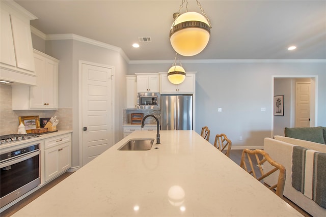 712 Tallgrass Dr, Aledo, TX 76008 - kitchen featuring stainless steel appliances, white cabinets, backsplash, ornamental molding, and recessed lighting