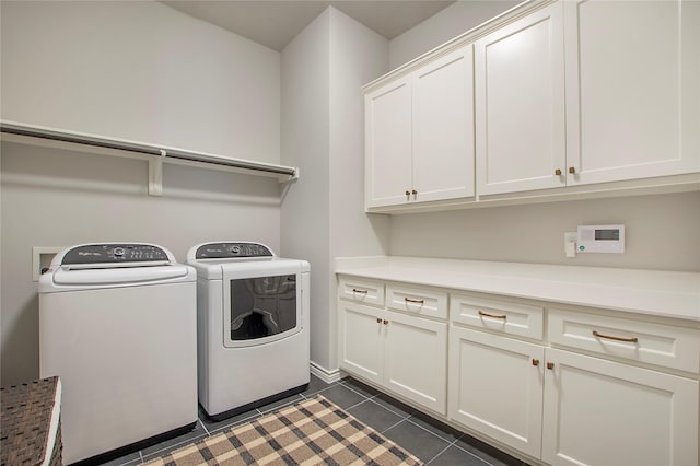 712 Tallgrass Dr, Aledo, TX 76008 - laundry room with cabinet space, washing machine and clothes dryer, and dark tile patterned floors