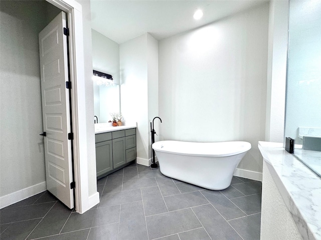 2402 Amesbury Dr, Midlothian, TX 76065 - full bath with vanity, a freestanding tub, tile patterned flooring, and recessed lighting