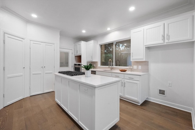 2800 Broadacres Ln, Dalworthington Gardens, TX 76016 - kitchen with crown molding, dark wood-style floors, white cabinetry, a kitchen island, and recessed lighting