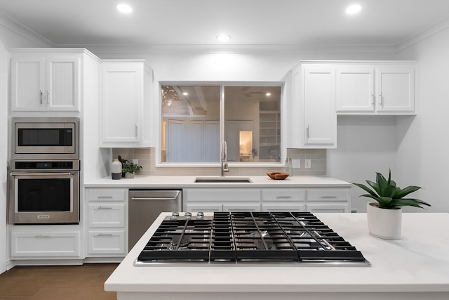 2800 Broadacres Ln, Dalworthington Gardens, TX 76016 - kitchen with stainless steel appliances, white cabinetry, tasteful backsplash, ornamental molding, and recessed lighting