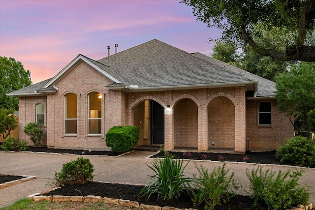 2800 Broadacres Ln, Dalworthington Gardens, TX 76016 - view of front of property featuring roof with shingles, brick siding, and a porch