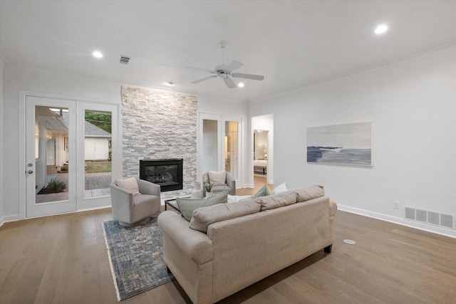 2800 Broadacres Ln, Dalworthington Gardens, TX 76016 - living room with wood finished floors, ceiling fan, a stone fireplace, recessed lighting, and ornamental molding