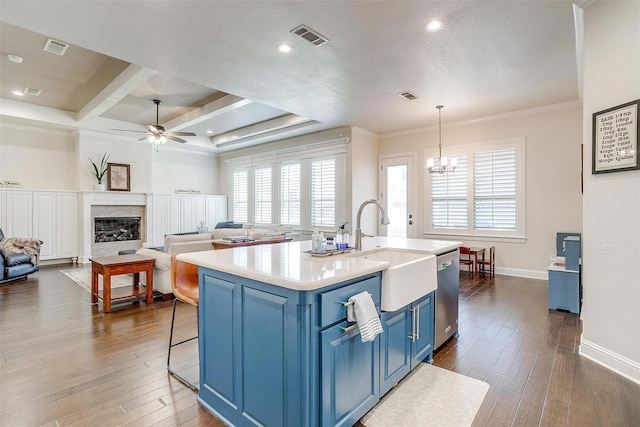 306 Creekview Ter, Aledo, TX 76008 - kitchen featuring blue cabinetry, stainless steel dishwasher, a ceiling fan, light countertops, and plenty of natural light