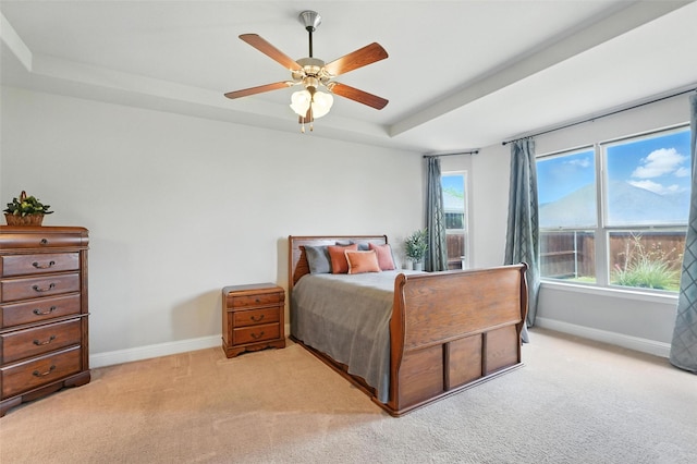 7508 Guadalupe Way, Mckinney, TX 75071 - bedroom with a raised ceiling, light colored carpet, and a ceiling fan