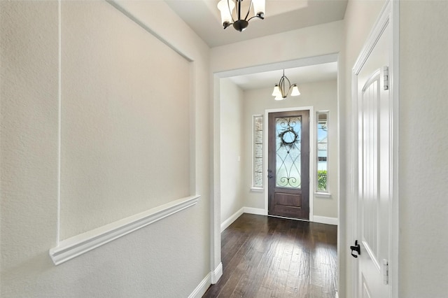 7508 Guadalupe Way, Mckinney, TX 75071 - entryway with a chandelier and dark wood-style flooring
