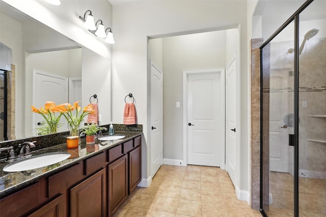 7508 Guadalupe Way, Mckinney, TX 75071 - full bathroom with double vanity, a shower stall, and tile patterned floors