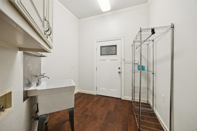 307 Ada St, Irving, TX 75061 - washroom with cabinet space, dark wood-style floors, ornamental molding, and washer hookup