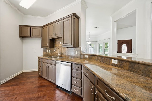 307 Ada St, Irving, TX 75061 - kitchen featuring stainless steel dishwasher, dark wood-style flooring, crown molding, tasteful backsplash, and dark stone countertops