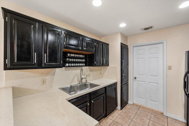 4056 La Costa Ct, Irving, TX 75038 - kitchen featuring dark cabinetry, dishwasher, light tile patterned flooring, light countertops, and recessed lighting