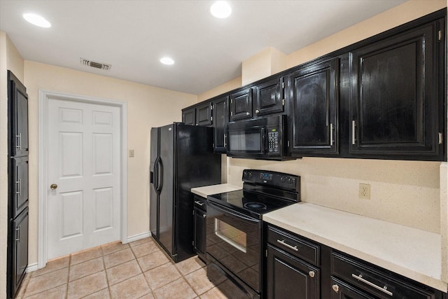 4056 La Costa Ct, Irving, TX 75038 - kitchen featuring dark cabinetry, black appliances, light countertops, light tile patterned floors, and recessed lighting