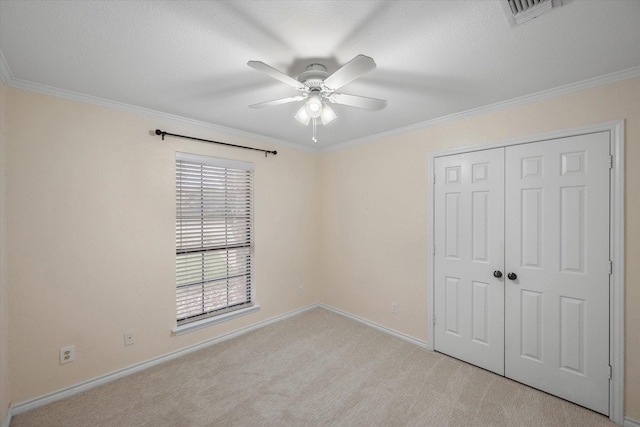 4056 La Costa Ct, Irving, TX 75038 - unfurnished bedroom with carpet flooring, a closet, crown molding, and ceiling fan