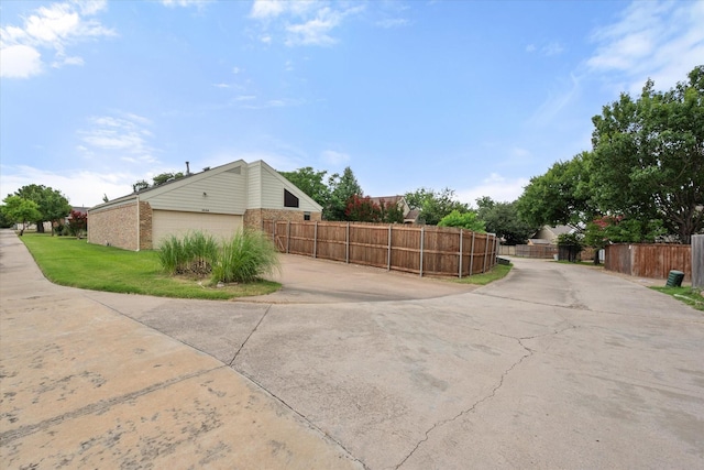 4056 La Costa Ct, Irving, TX 75038 - view of property exterior featuring brick siding and concrete driveway
