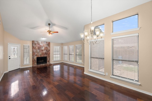 4056 La Costa Ct, Irving, TX 75038 - unfurnished living room featuring a chandelier, wood finished floors, ceiling fan, a stone fireplace, and vaulted ceiling