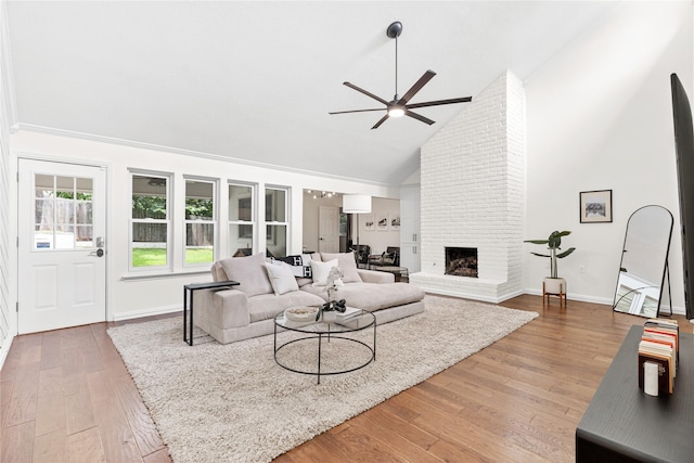 2822 Harvest Hill Dr, Grapevine, TX 76051 - living area with ceiling fan, high vaulted ceiling, wood finished floors, and a brick fireplace