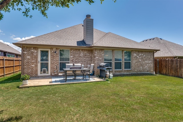 1289 Lasso Dr, Little Elm, TX 75068 - back of house with brick siding, a fenced backyard, a chimney, and a patio area