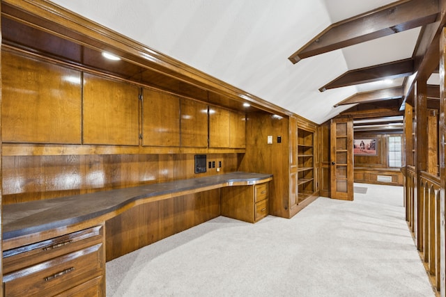 1605 Canyon Oaks Dr, Irving, TX 75061 - bar with built in study area, wooden walls, lofted ceiling, and light colored carpet