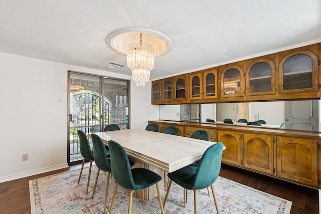 1605 Canyon Oaks Dr, Irving, TX 75061 - dining room with a chandelier and dark wood-style floors