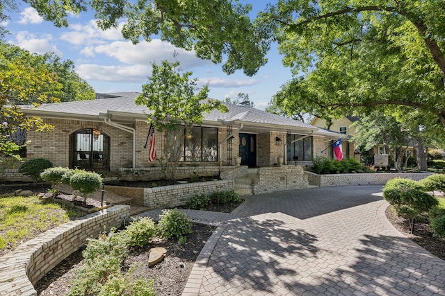 1605 Canyon Oaks Dr, Irving, TX 75061 - view of front of house featuring brick siding and a shingled roof