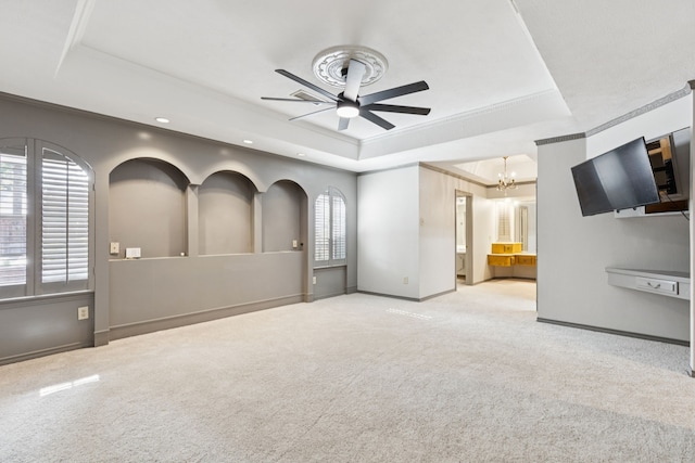 1605 Canyon Oaks Dr, Irving, TX 75061 - unfurnished living room featuring a tray ceiling, crown molding, a ceiling fan, carpet floors, and a chandelier